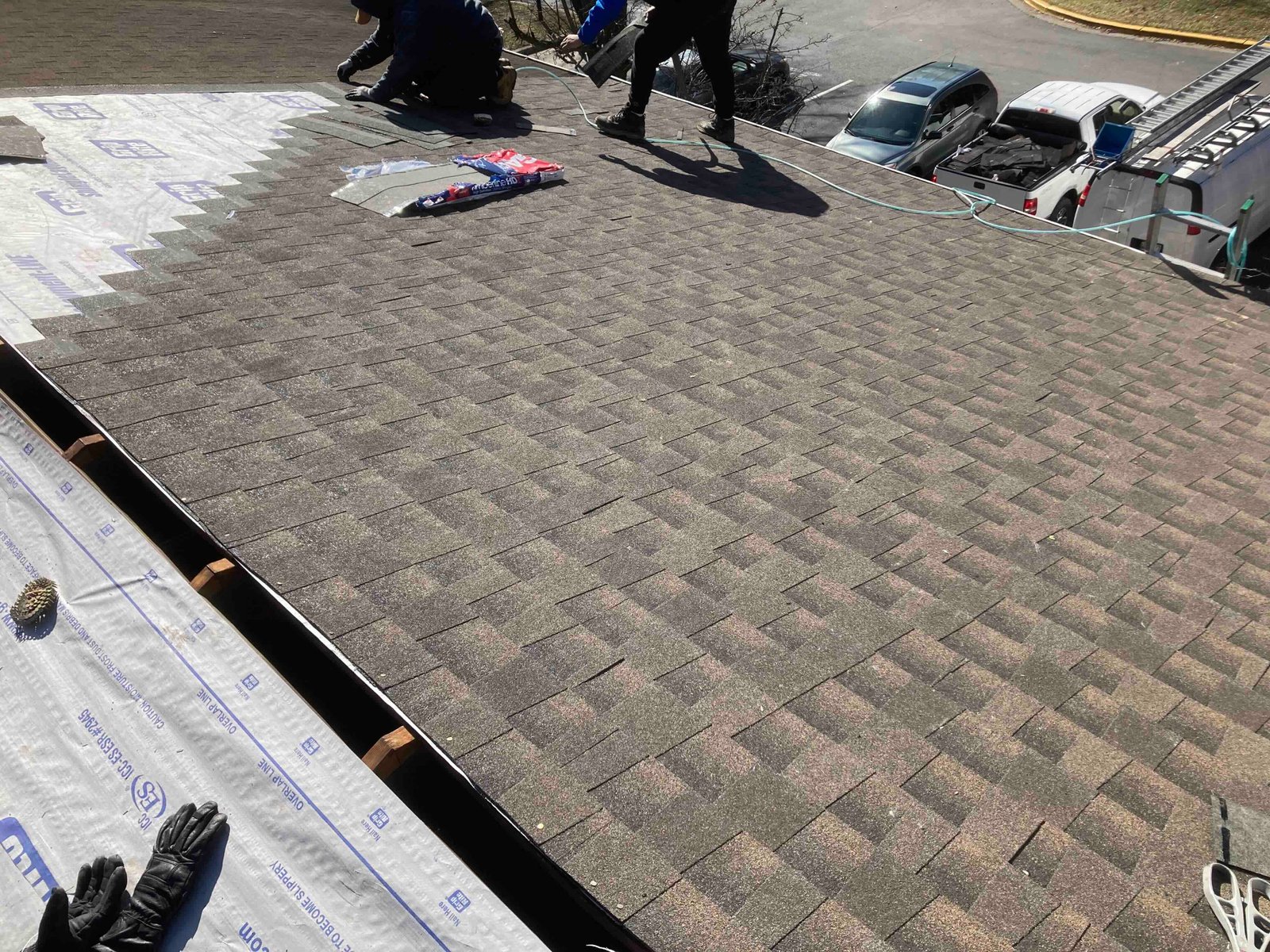 Professional roofer installing new roof