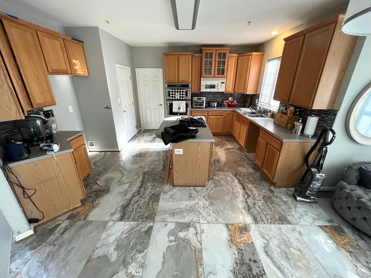 Full kitchen remodel with new cabinetry and flooring